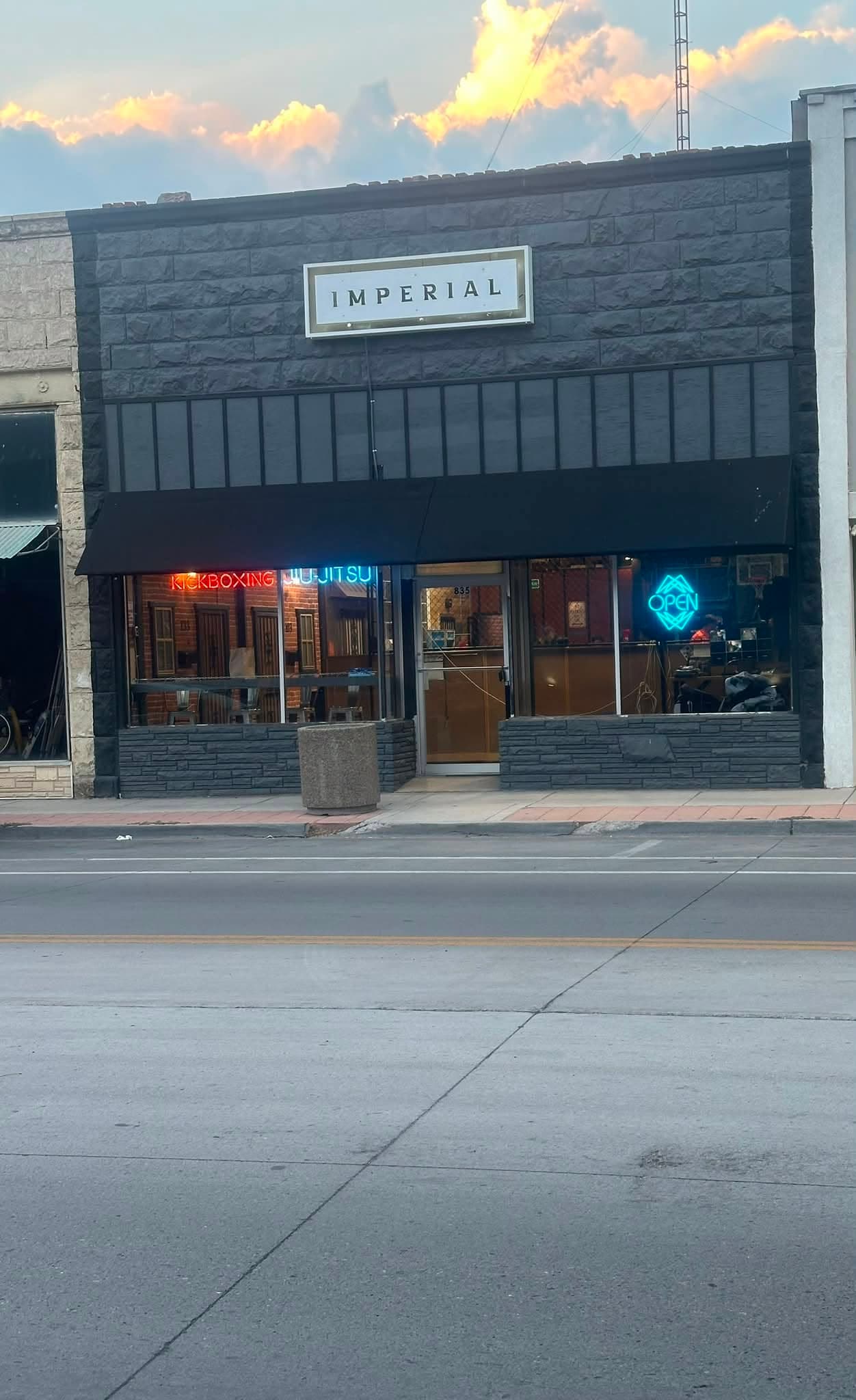 The Imperial South storefront on 1st Avenue in Monte Vista, lit at night
